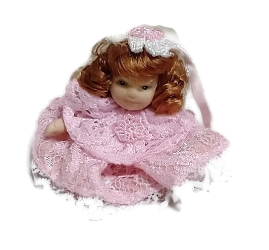 Miniature porcelain Doll Cochet Dress Pink